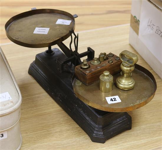 A set of Victorian black painted cast iron scales, with brass pans and weights